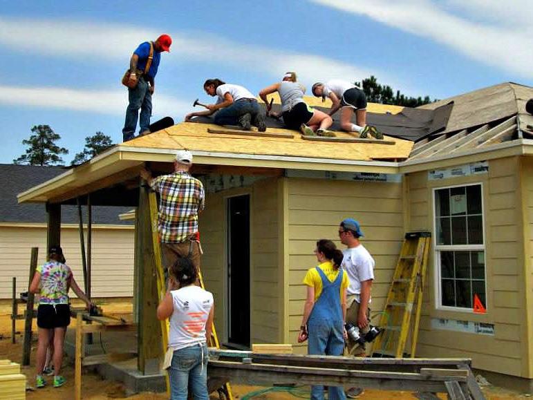 People working on a house for Habitat for Humanity, 2015